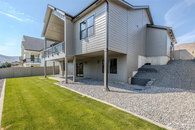 a view of an house with swimming pool and porch
