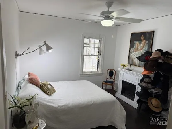 a bedroom with a bed and the chandelier