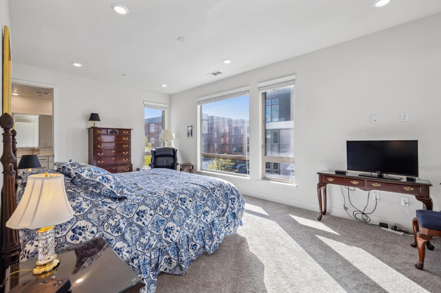 779 Eppleton Lane, Unit 304 Foster City, CA 94404 - Photo 19 of 34 a spacious bedroom with a bed and a flat screen television