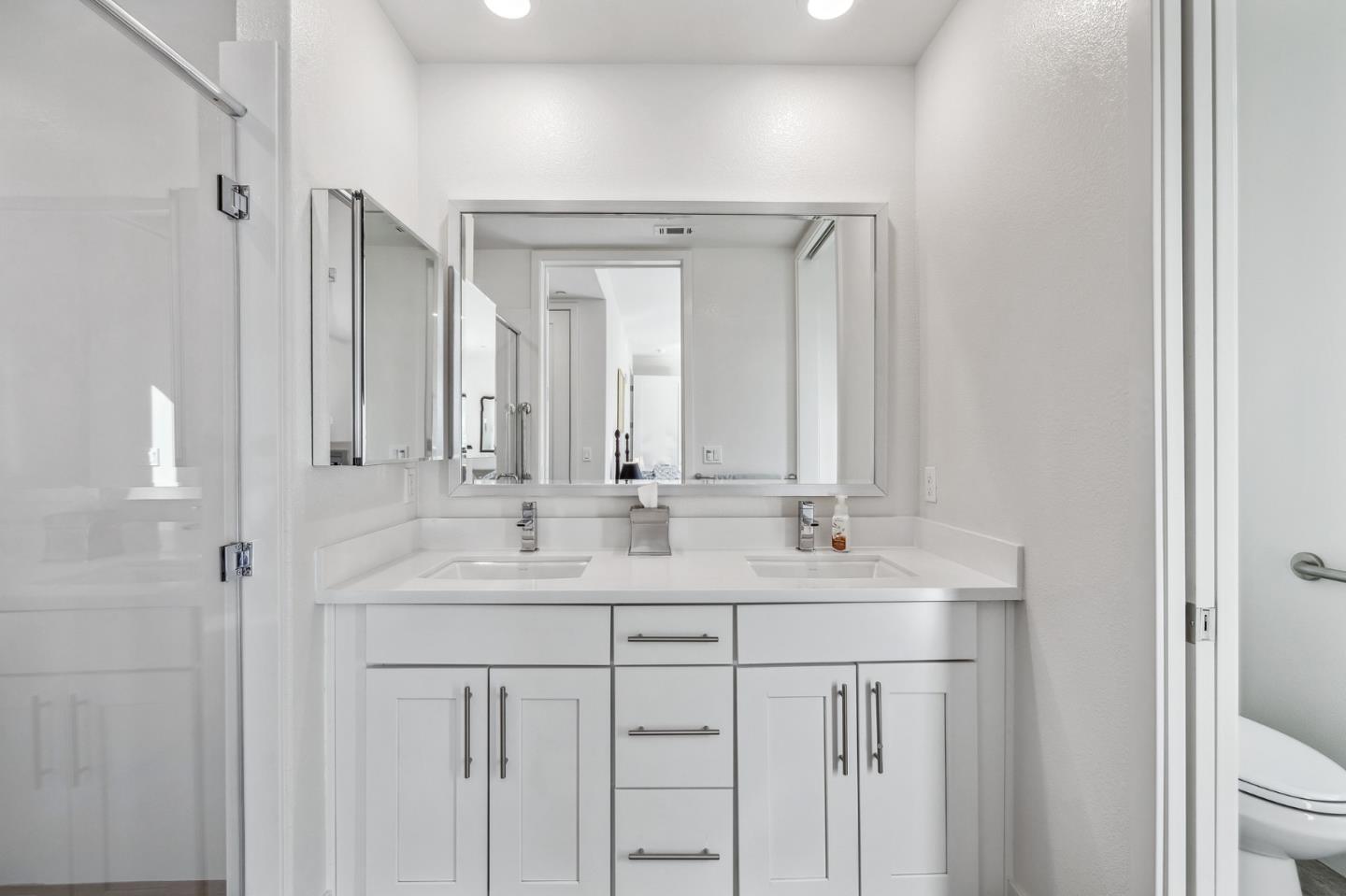 779 Eppleton Lane, Unit 304 Foster City, CA 94404 - Photo 22 of 34 a bathroom with a double vanity sink and mirror with shower