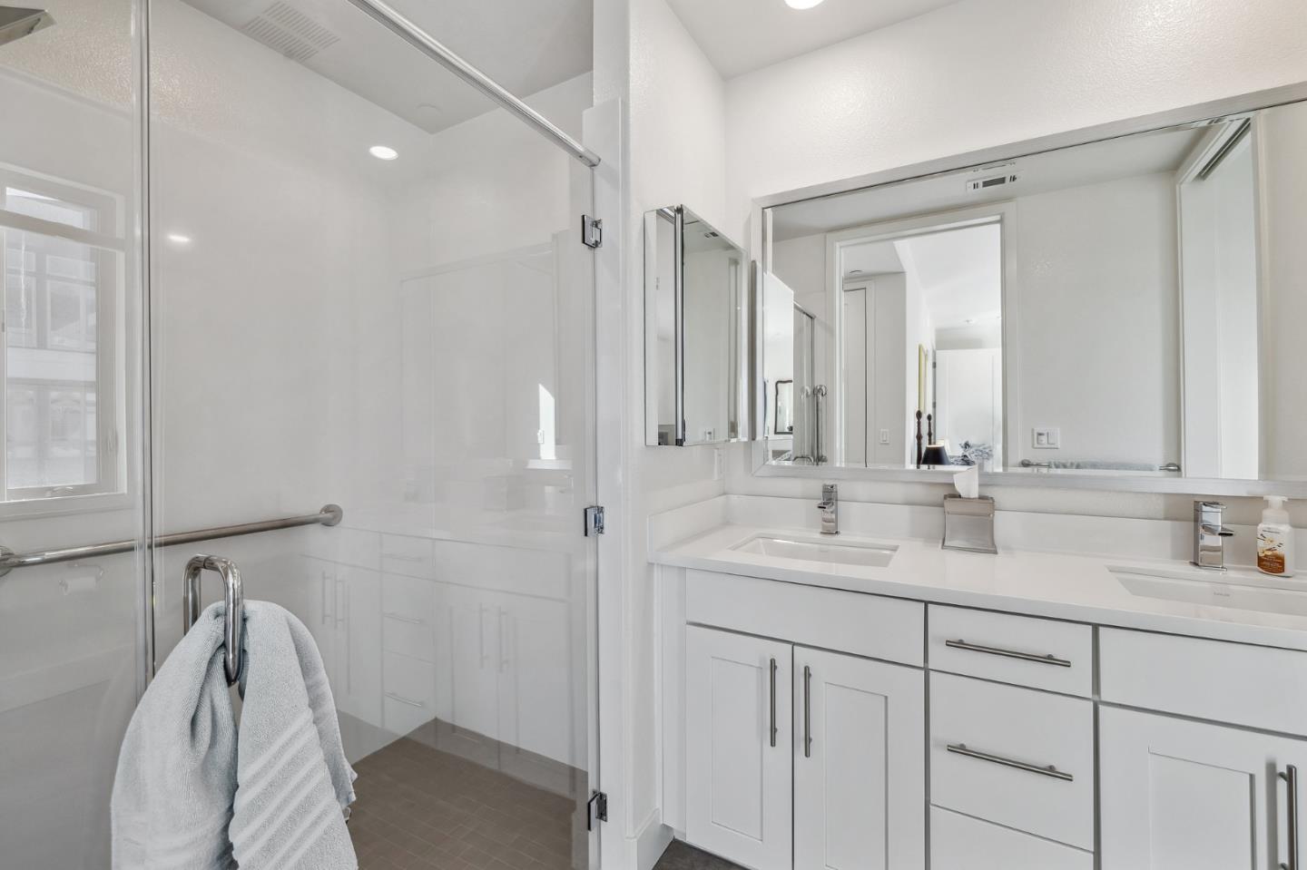 779 Eppleton Lane, Unit 304 Foster City, CA 94404 - Photo 23 of 34 a bathroom with a double vanity sink mirror and shower