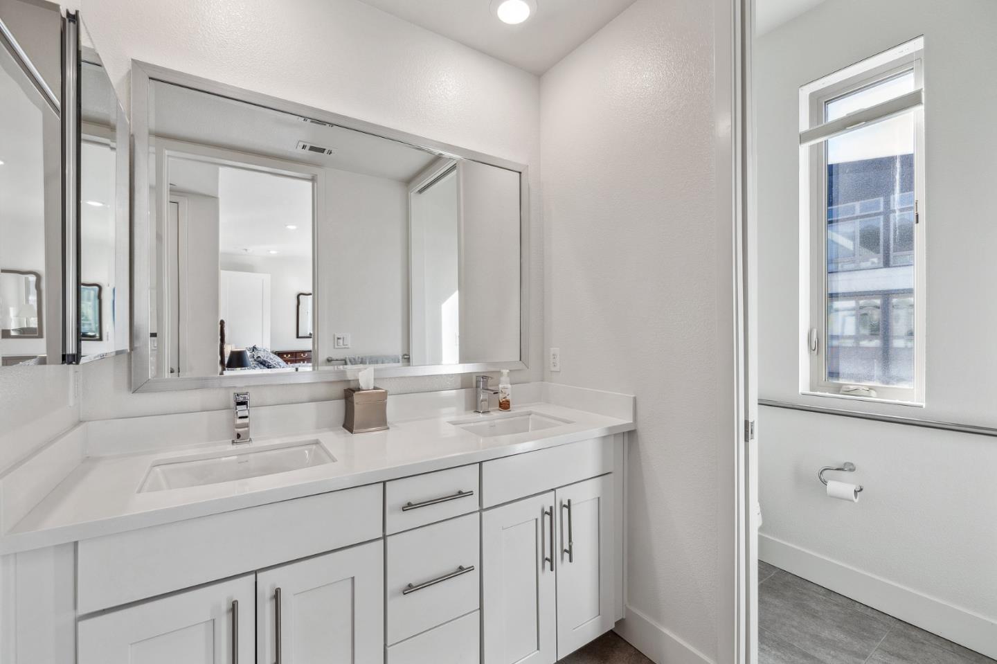 779 Eppleton Lane, Unit 304 Foster City, CA 94404 - Photo 25 of 34 a bathroom with 2 sink and a mirror