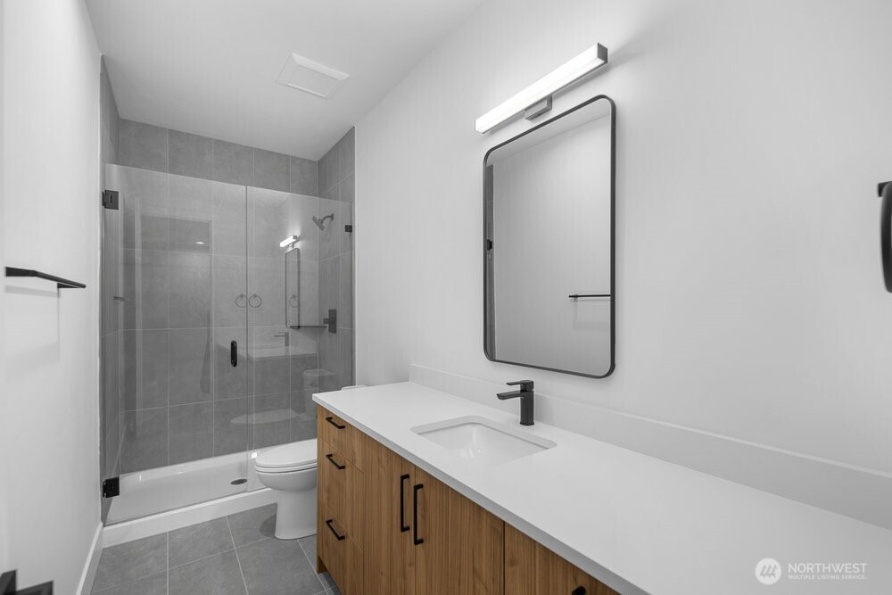 687 Northwest Locust Street Issaquah, WA 98027 - Photo 22 of 26 a bathroom with a sink a toilet and shower