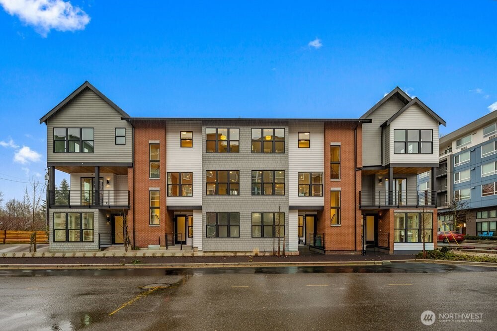 687 Northwest Locust Street Issaquah, WA 98027 - Photo 25 of 26 a front view of a building with lake view and windows