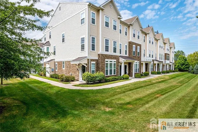 front view of a building with a yard