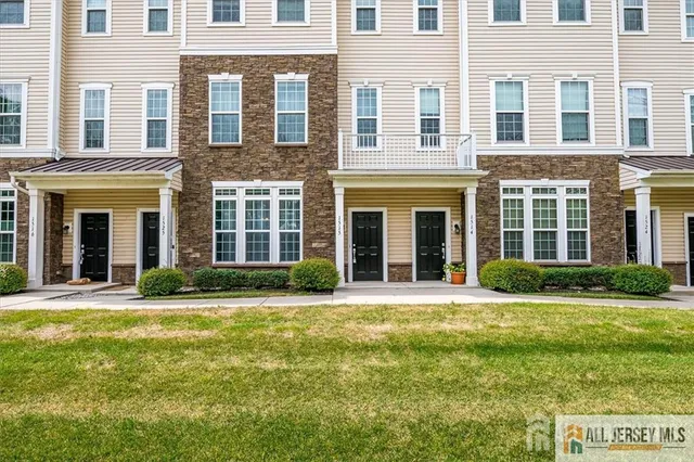 a view of a kitchen with a sink and a living room