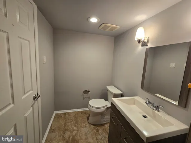 a bathroom with a sink a shower and a mirror