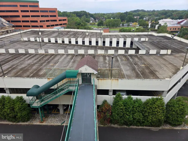 a view of a balcony with an outdoor seating