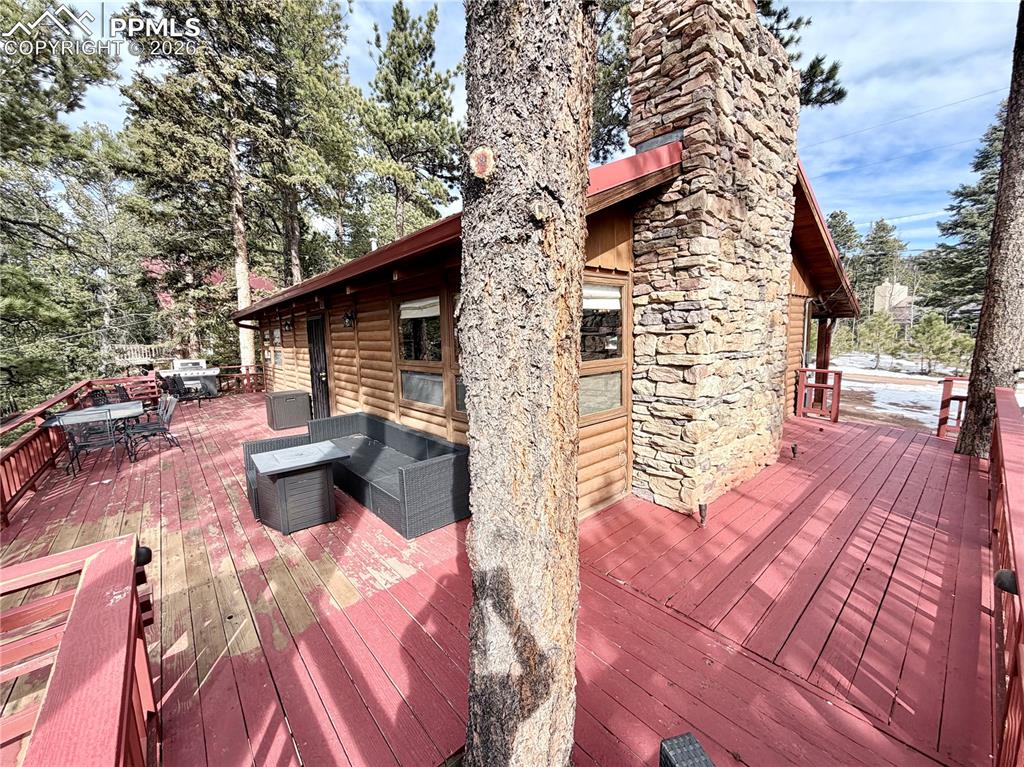121 St Charles Drive Rye, CO 81069 - Photo 17 of 22 Wooden terrace featuring outdoor dining space and an outdoor hangout area