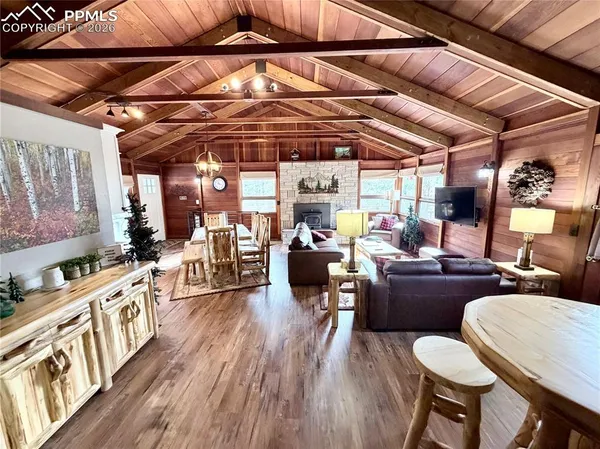 a living room with furniture and a book shelf