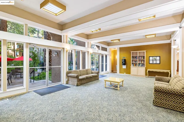 a swimming pool with outdoor seating and yard