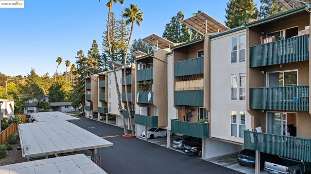 a view of a brick house with many windows and a table