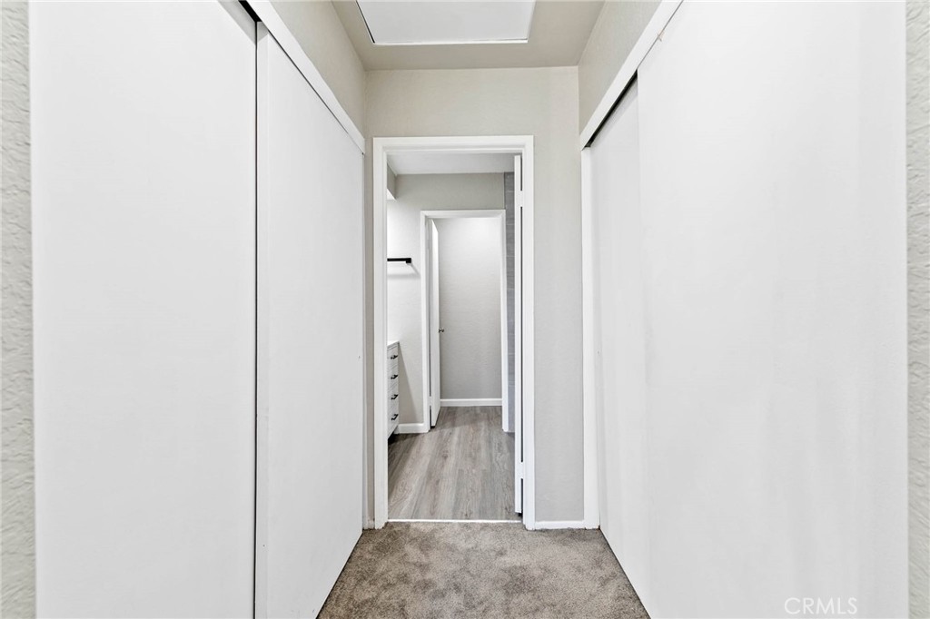 9013 Buckles Street Downey, CA 90241 - Photo 17 of 32 a view of hallway with closet and mirror