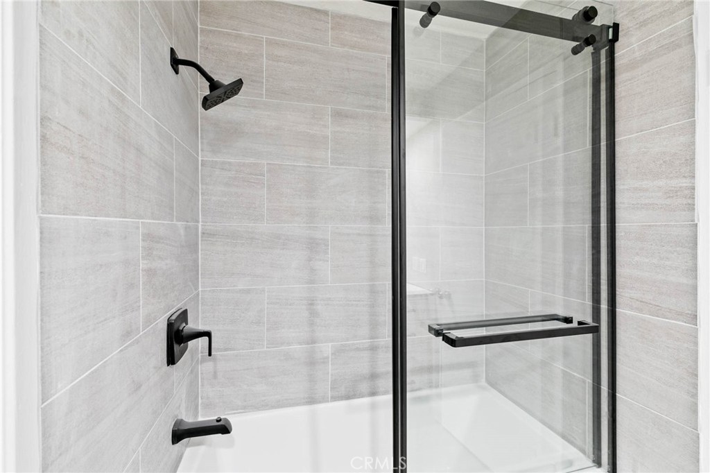 9013 Buckles Street Downey, CA 90241 - Photo 19 of 32 a bathroom with a shower