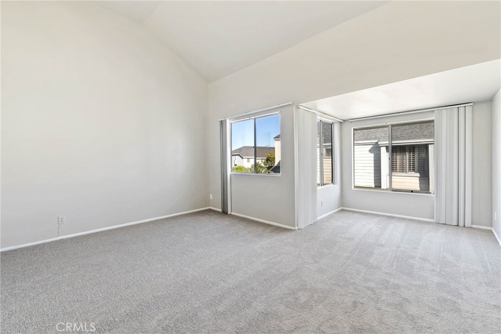 9013 Buckles Street Downey, CA 90241 - Photo 22 of 32 an empty room with windows