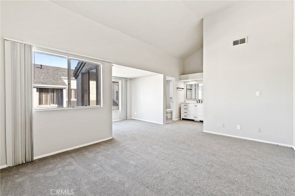 9013 Buckles Street Downey, CA 90241 - Photo 23 of 32 an empty room with windows