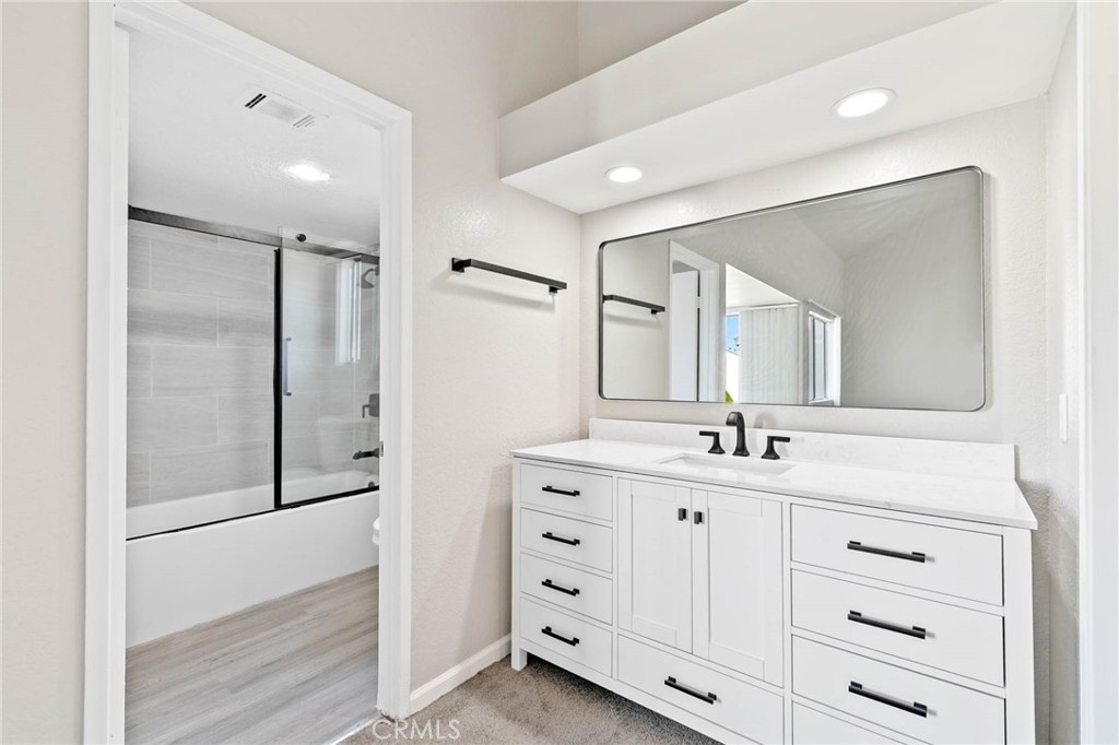 9013 Buckles Street Downey, CA 90241 - Photo 26 of 32 a bathroom with a double vanity sink and mirror