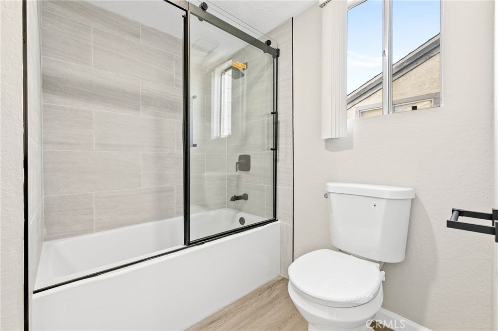 9013 Buckles Street Downey, CA 90241 - Photo 27 of 32 a bathroom with a toilet and a shower