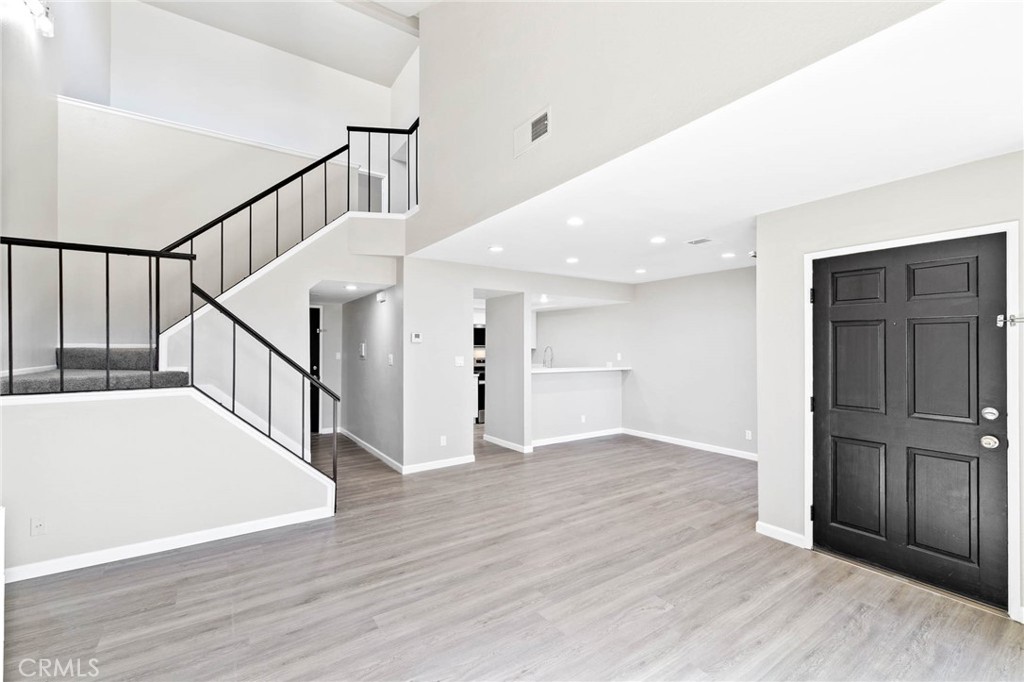 9013 Buckles Street Downey, CA 90241 - Photo 6 of 32 a view of entryway with wooden floor