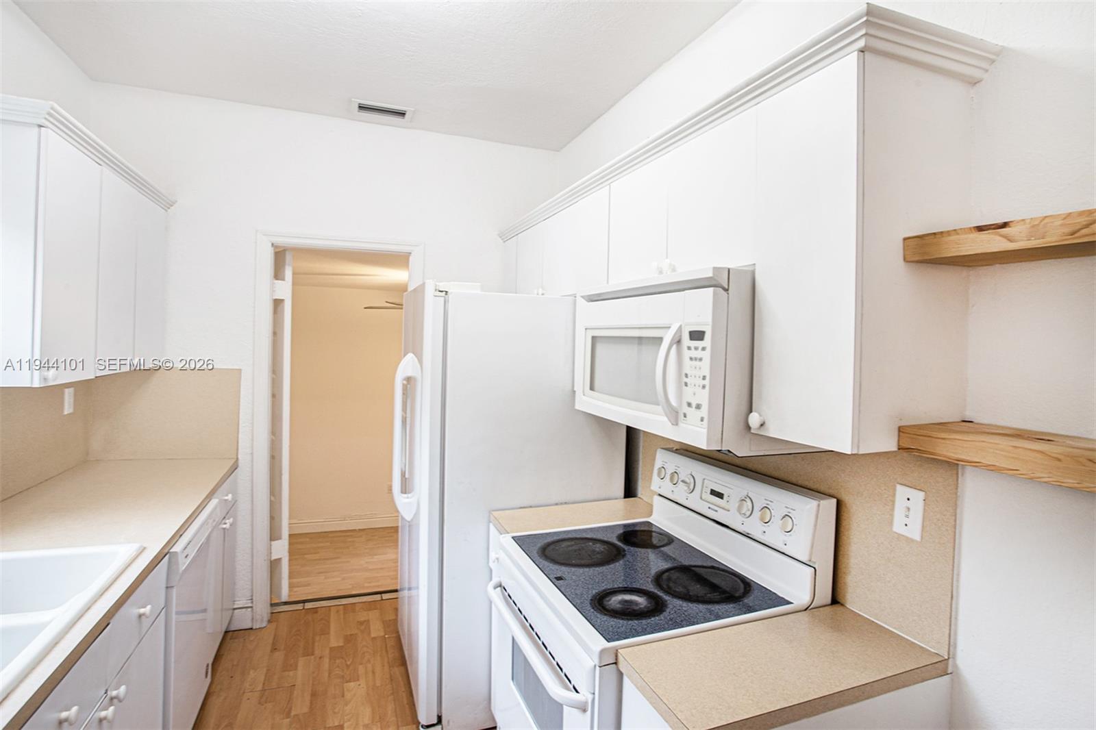 236 Southwest 28th Road Miami, FL 33129 - Photo 11 of 32 a kitchen with stainless steel appliances granite countertop a stove and a refrigerator