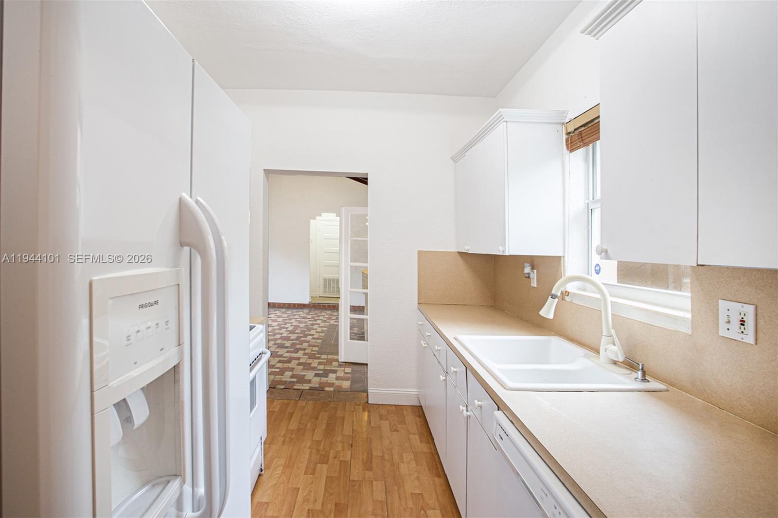 236 Southwest 28th Road Miami, FL 33129 - Photo 12 of 32 a kitchen with a refrigerator and a sink