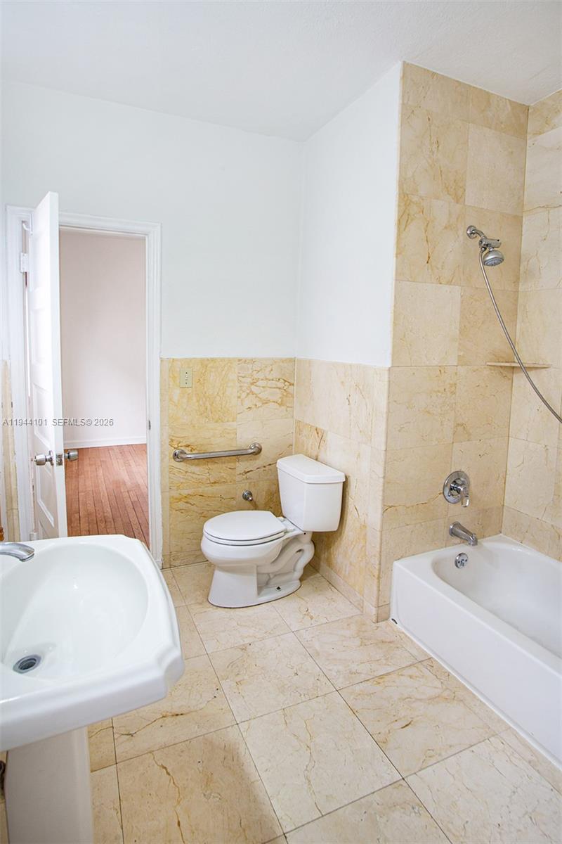 236 Southwest 28th Road Miami, FL 33129 - Photo 21 of 32 a bathroom with a sink a toilet and bathtub