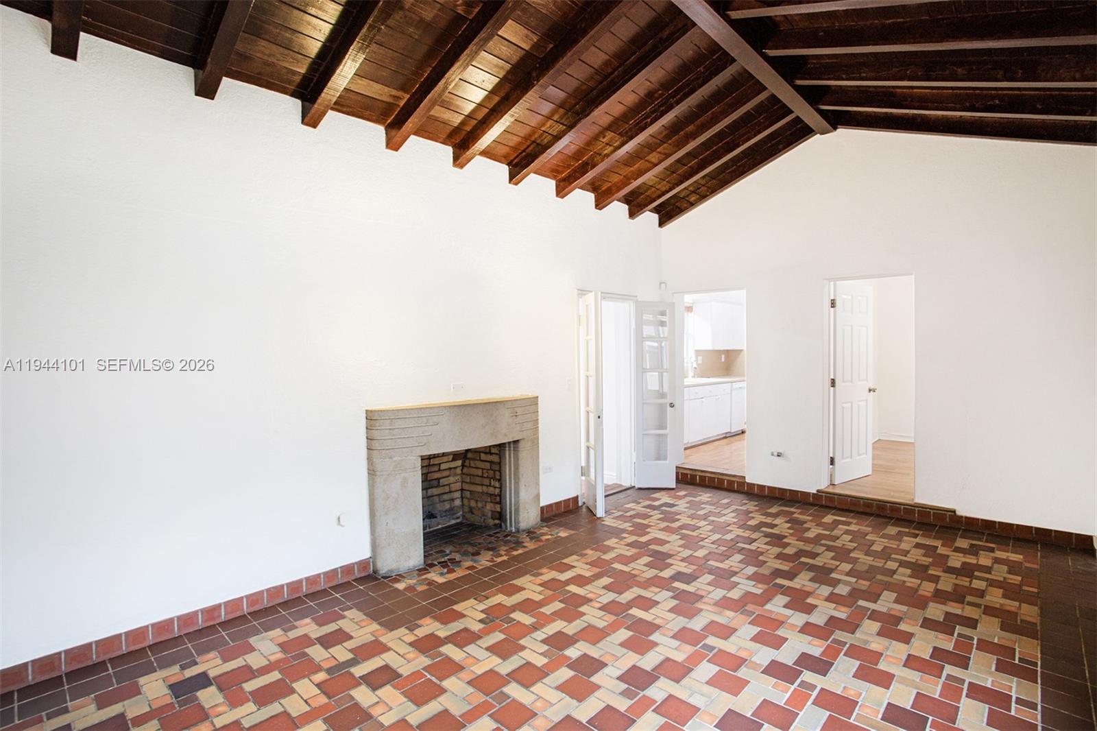 236 Southwest 28th Road Miami, FL 33129 - Photo 3 of 32 a view of an empty room with a fireplace