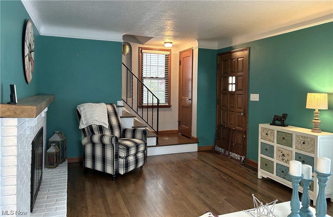 1748 Sunview Road Lyndhurst, OH 44124 - Photo 4 of 41 Living area featuring hardwood floor, and a brick fireplace.