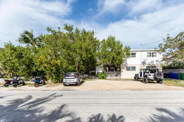 a view of a street with houses on both side