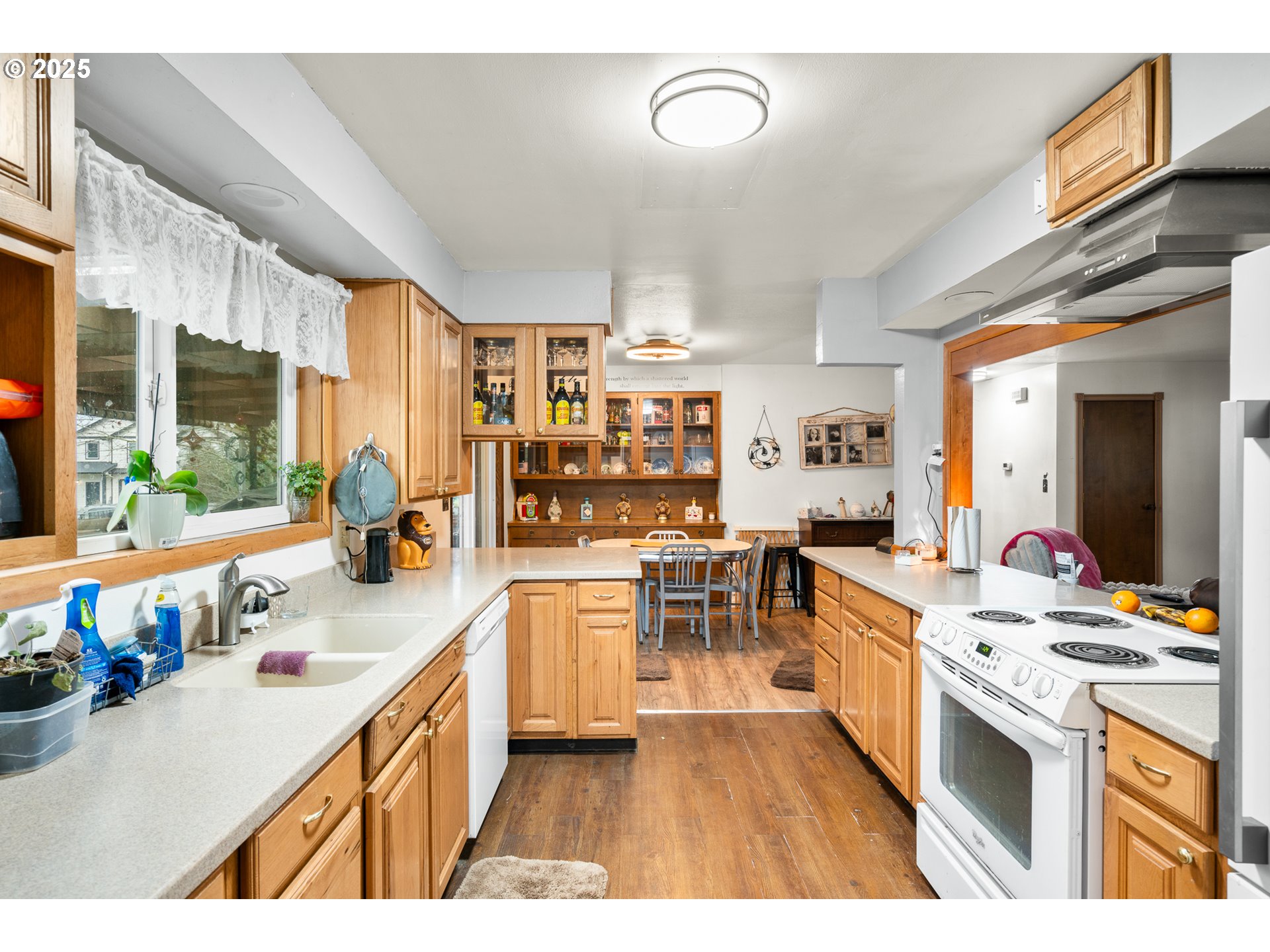 319 Monitor Road Silverton, OR 97381 - Photo 13 of 32 a open kitchen with stainless steel appliances kitchen island granite countertop a sink dishwasher stove and white cabinets next to a window