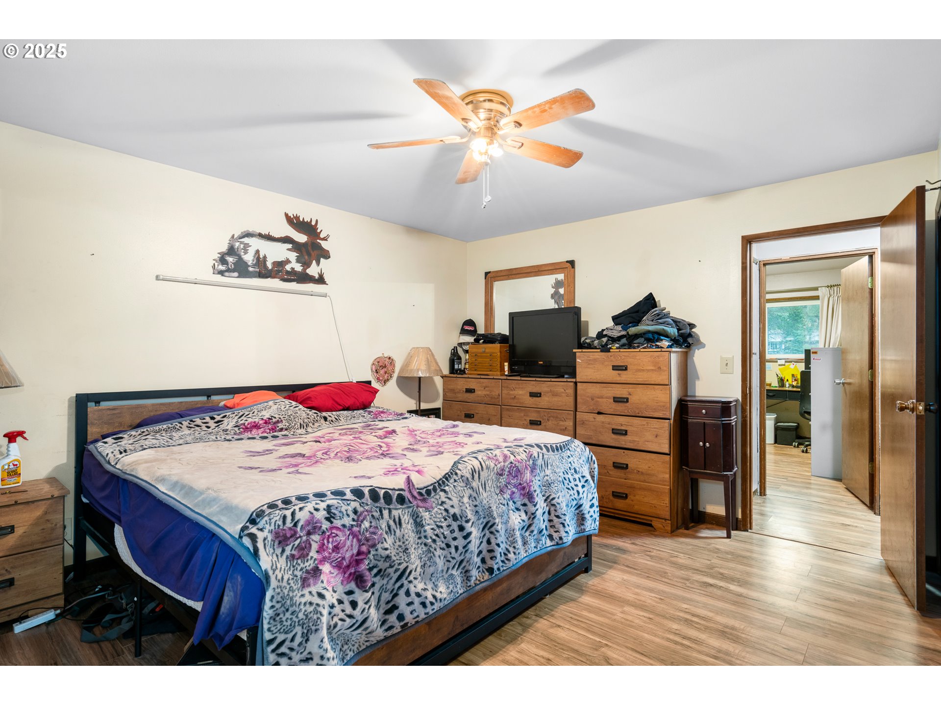 319 Monitor Road Silverton, OR 97381 - Photo 15 of 32 a bedroom with a bed and dresser with wooden floor