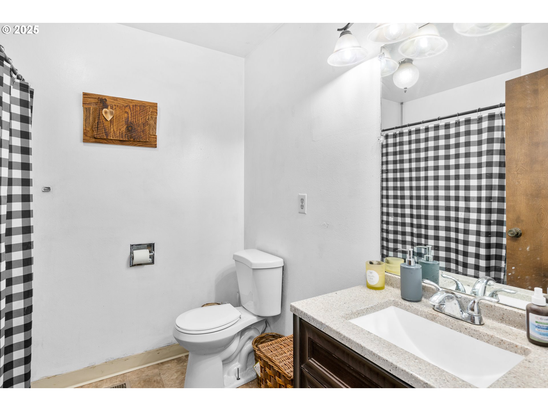319 Monitor Road Silverton, OR 97381 - Photo 17 of 32 a bathroom with a granite countertop toilet sink and mirror