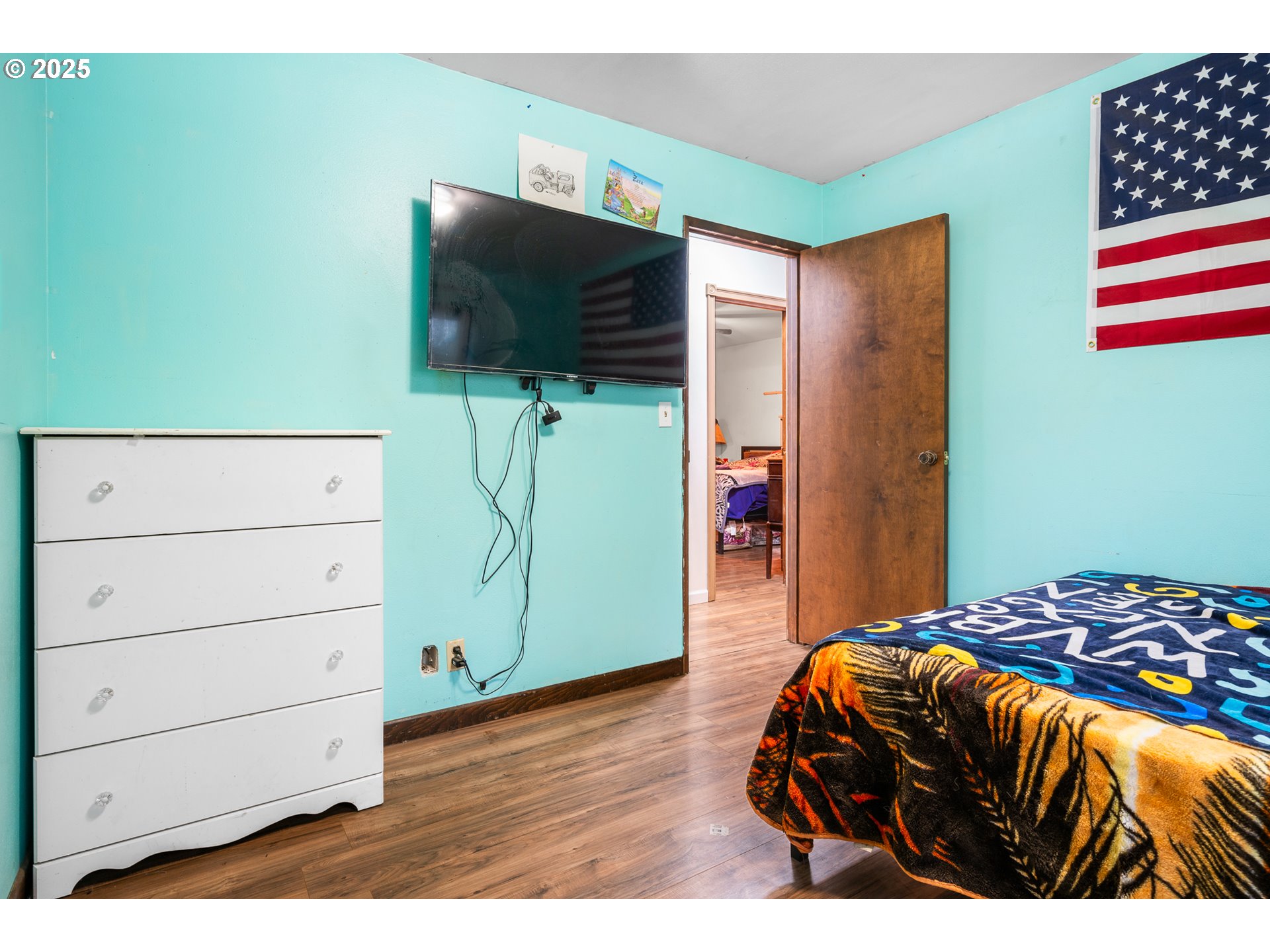 319 Monitor Road Silverton, OR 97381 - Photo 19 of 32 a bedroom with a bed and a flat screen tv
