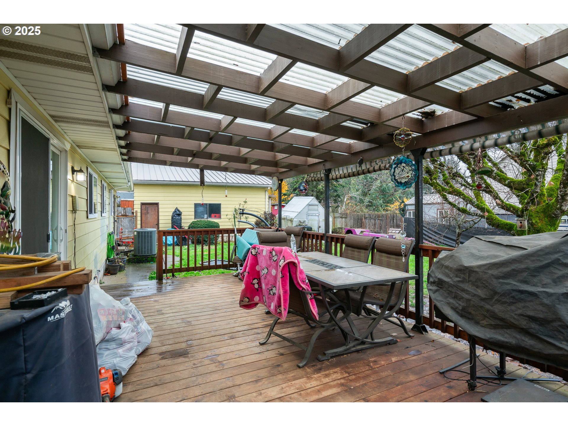319 Monitor Road Silverton, OR 97381 - Photo 28 of 32 a view of a chairs and table in patio with a wooden fence