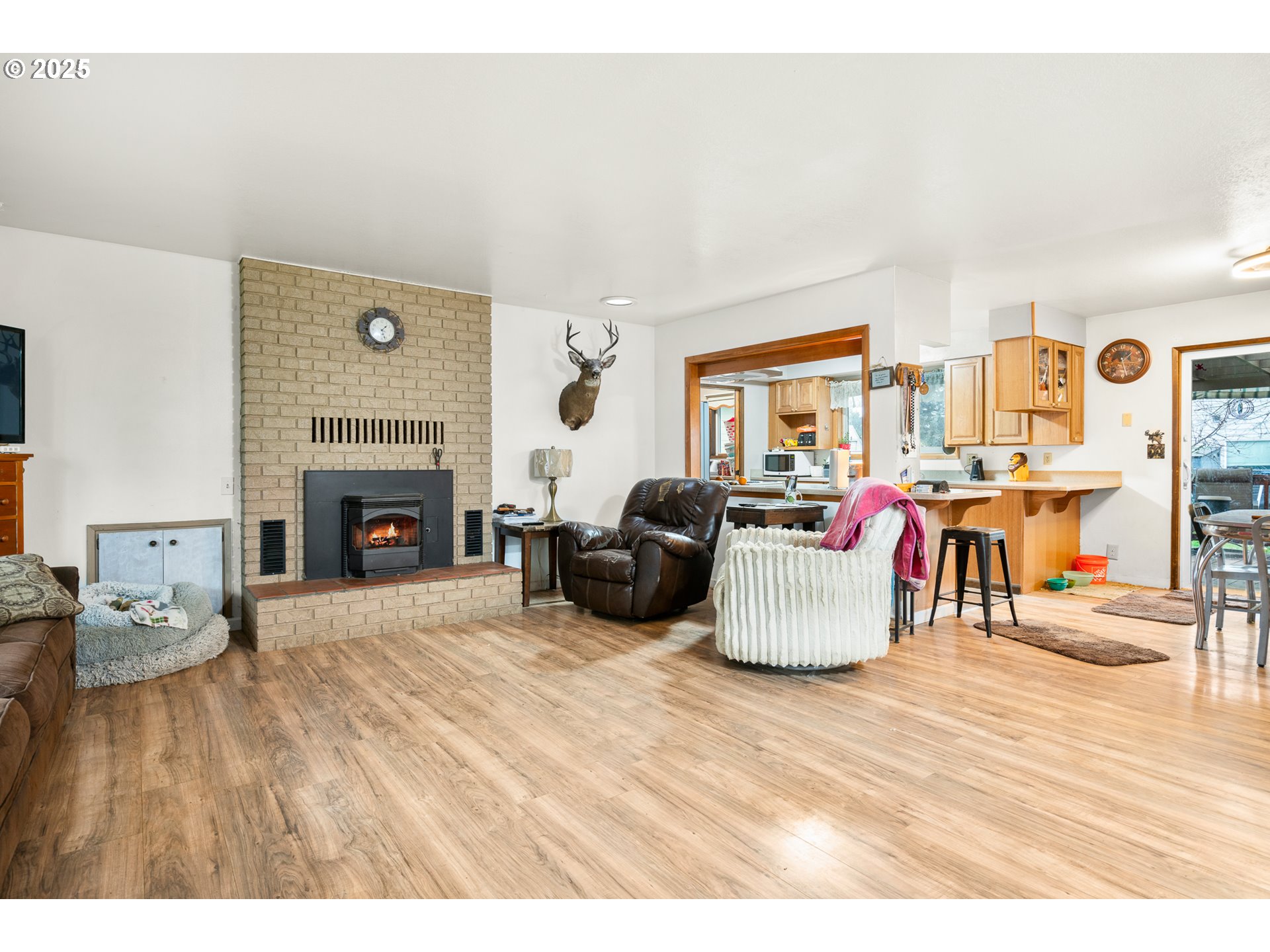 319 Monitor Road Silverton, OR 97381 - Photo 5 of 32 a living room with furniture and a fireplace