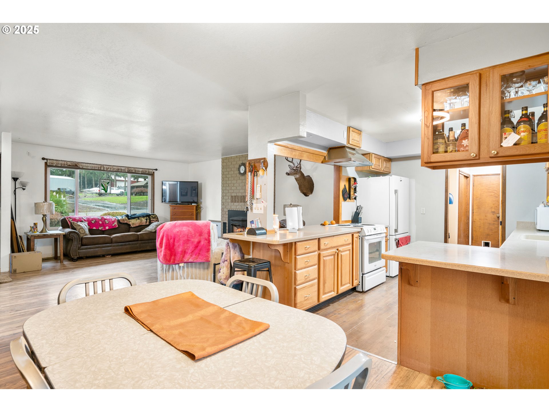 319 Monitor Road Silverton, OR 97381 - Photo 10 of 32 a living room with furniture a flat screen tv and a dresser