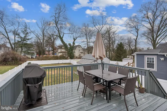 a view of yard with swimming pool and green space