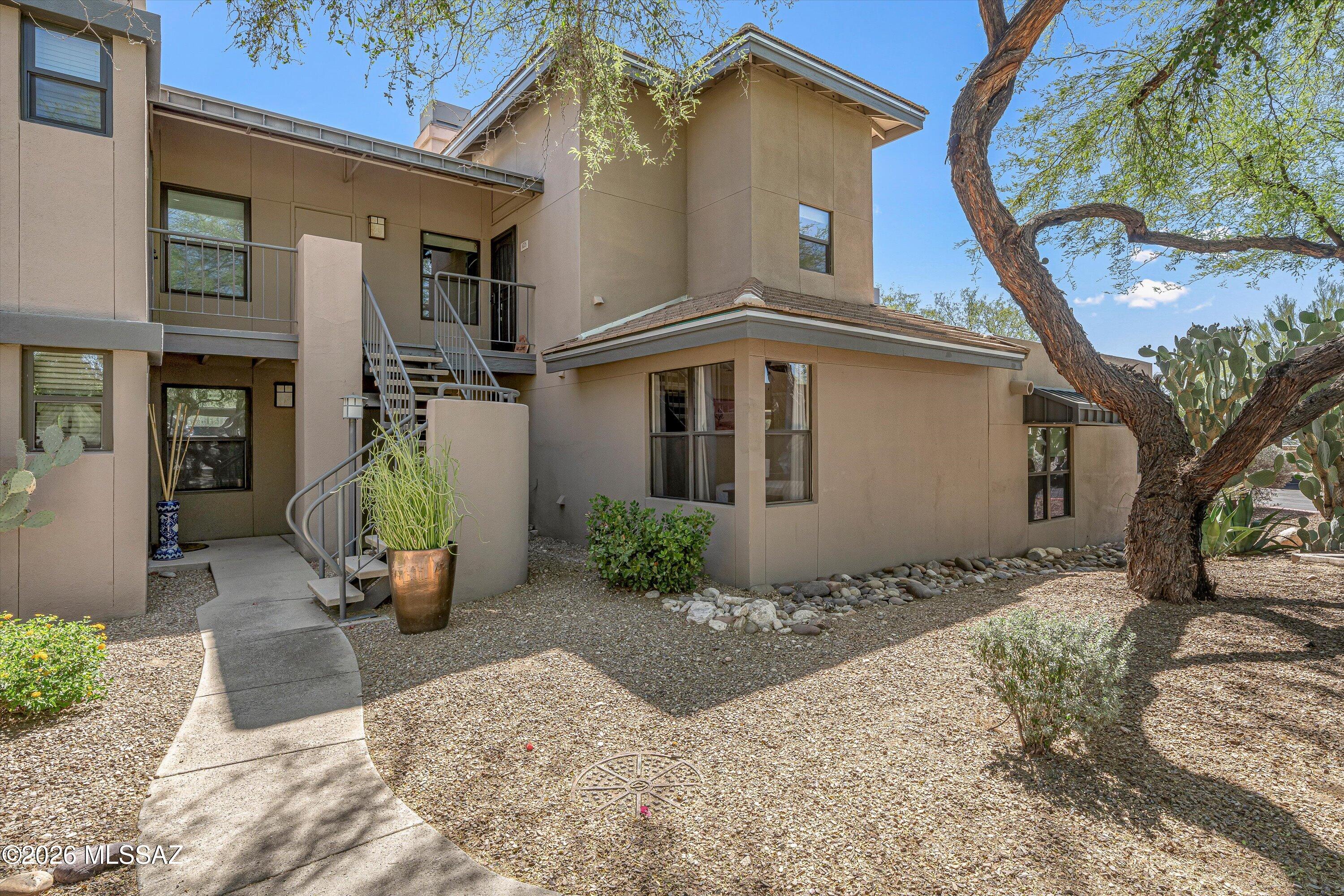 5800 North Kolb Road, Unit 5125 Tucson, AZ 85750 - Photo 1 of 34 a view of a house with a yard