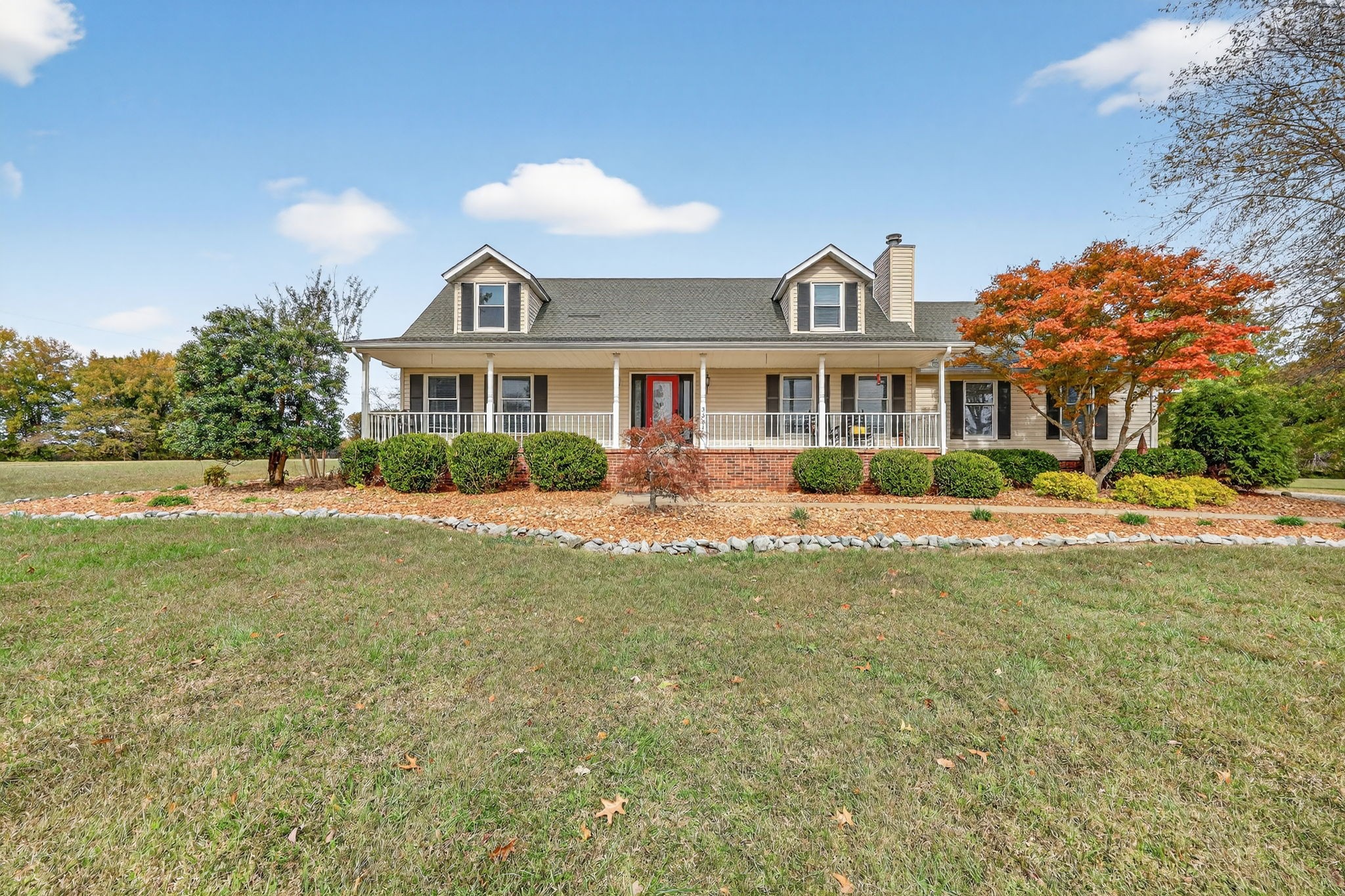 a front view of a house with a yard