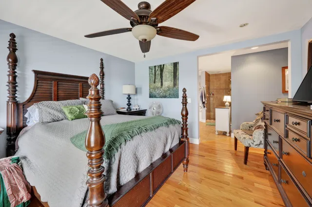 a spacious bathroom with a double vanity sink a mirror and a bathtub