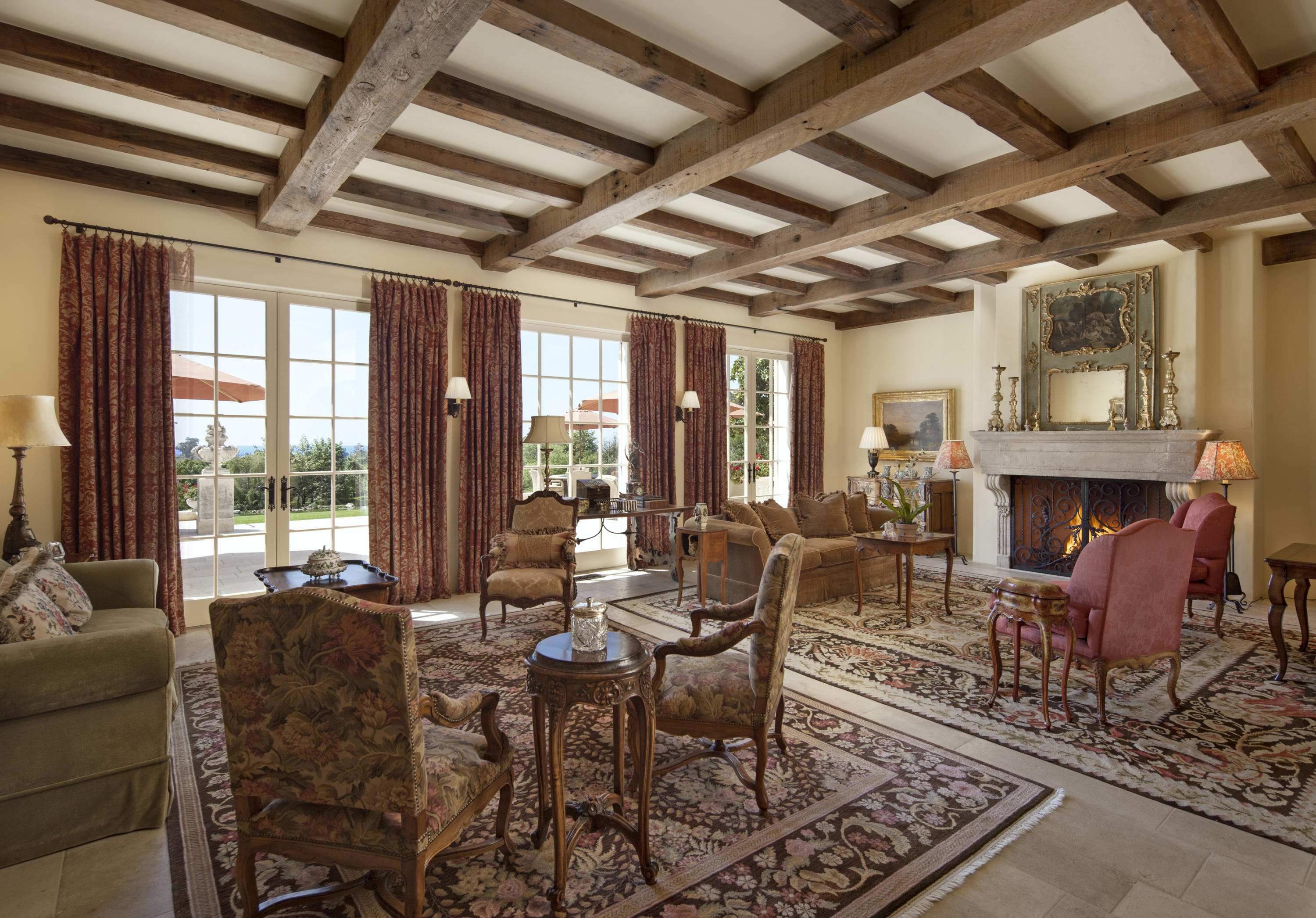 690 Picacho Lane Montecito, CA 93108 - Photo 11 of 22 a living room with furniture windows and a fireplace