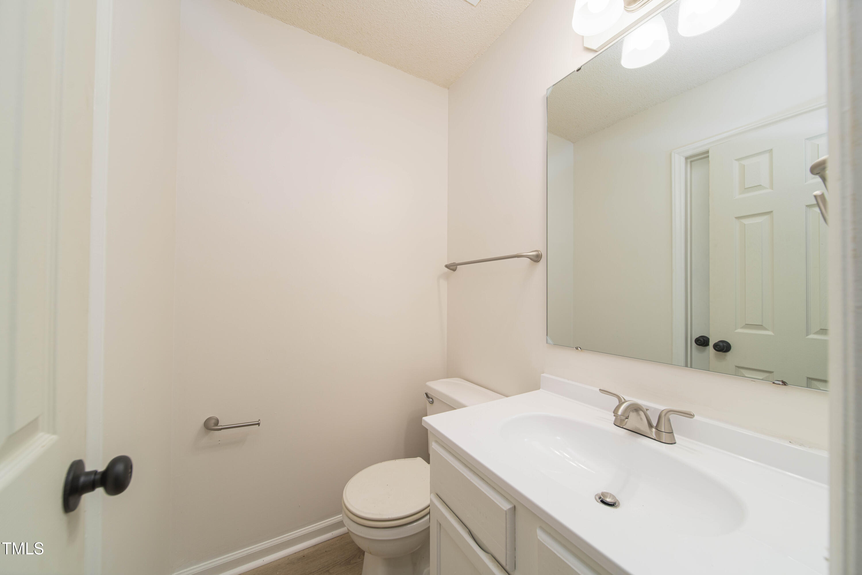 4258 Kaplan Drive Raleigh, NC 27606 - Photo 17 of 20 a bathroom with a sink toilet and shower