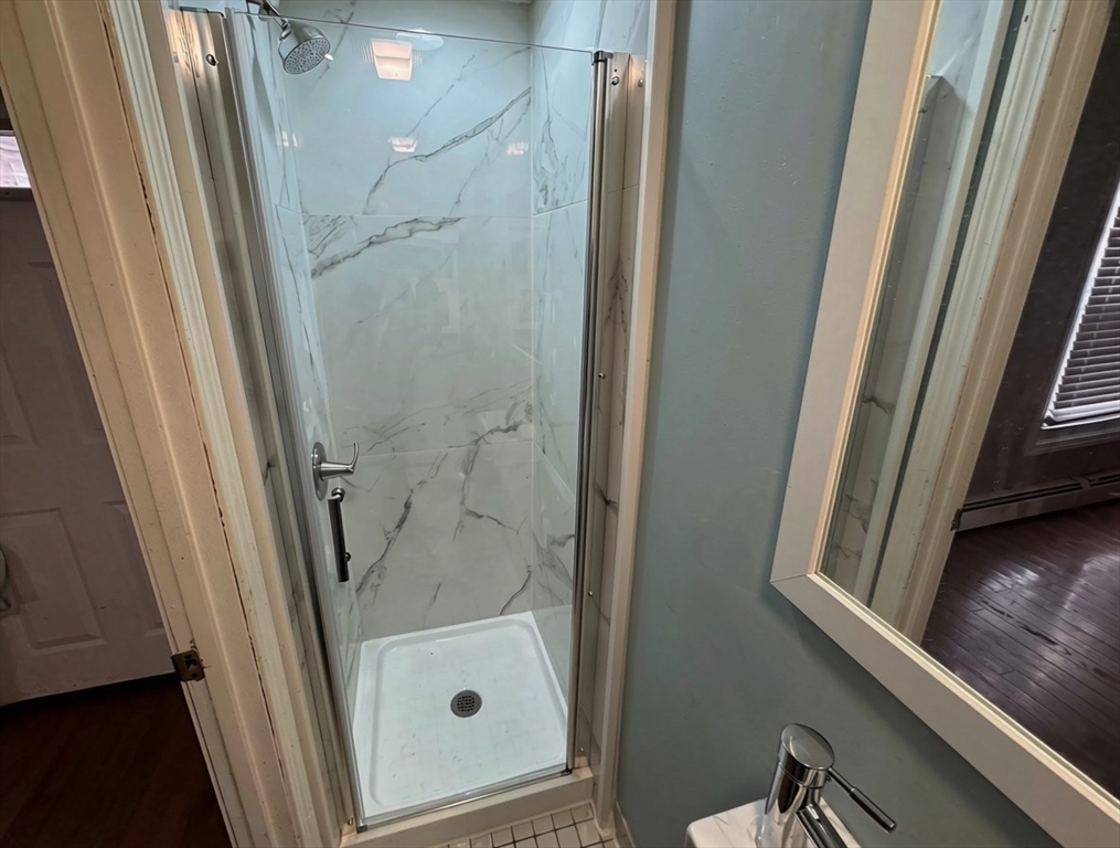 700 2nd Street, Unit 110 Fall River, MA 02721 - Photo 5 of 17 a bathroom with a tub and a shower