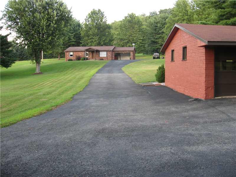 Exterior Front. Paved Driveway