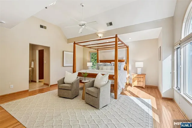 a living room with furniture and large windows