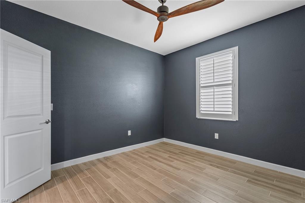 1779 Hagen Court Naples, FL 34120 - Photo 17 of 36 an empty room with windows