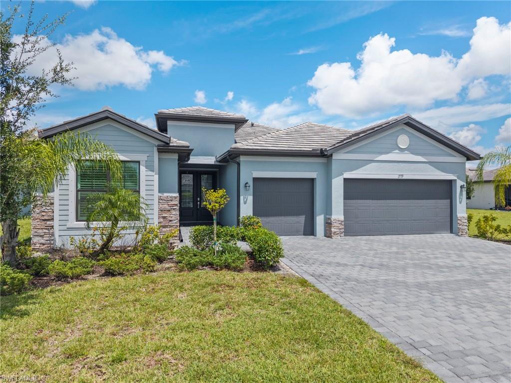 1779 Hagen Court Naples, FL 34120 - Photo 35 of 36 a front view of a house with garden