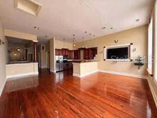a view of a kitchen with a sink and a fireplace