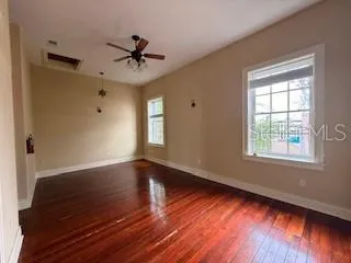 wooden floor in an empty room with a window