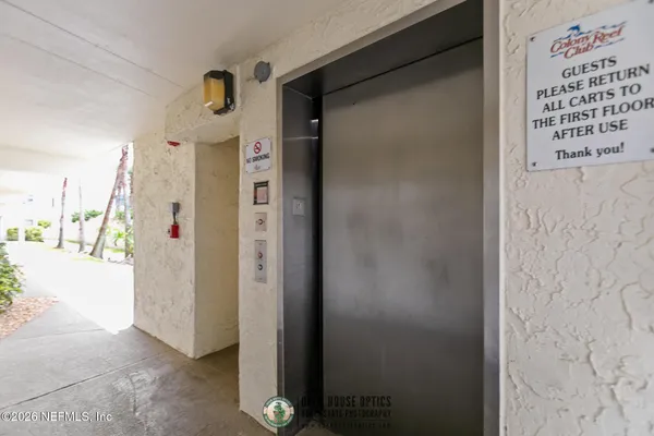 a view of a hallway with windows